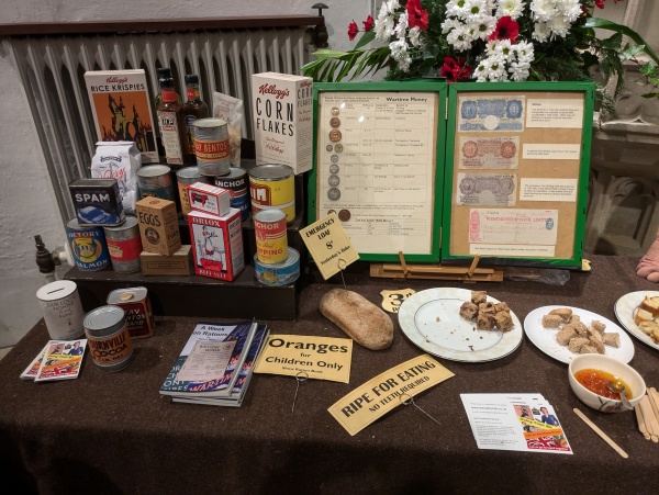 Display of WW2 food packaging and other memorabilia, plus examples of foods produced from WW2 receipes 