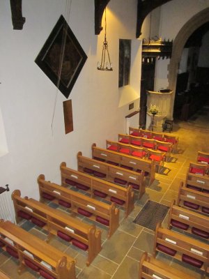 View of the interior of St James the Great, Radley, showing the war memorial on the north wall under the funeral hatchment of Sir George Bowyer who died in 1860 and is buried in the Stonhouse and Bowyer vault